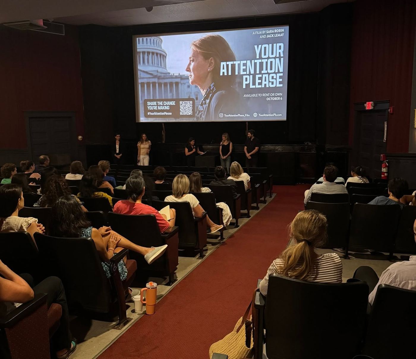 Full theater room during the Your Attention Please panel discussion
