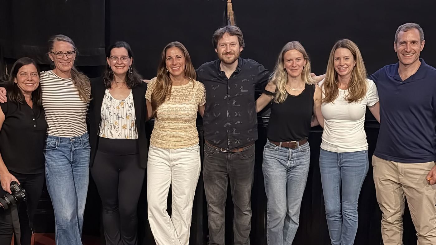 Panelists, moderator, and event organizers together after the Your Attention Please screening