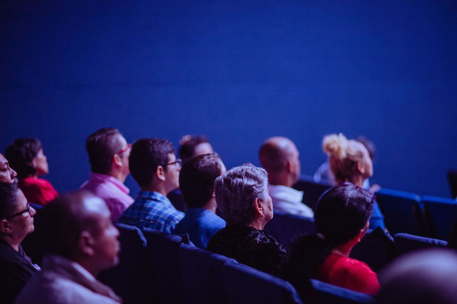 Parents gathered together listening at a community talk